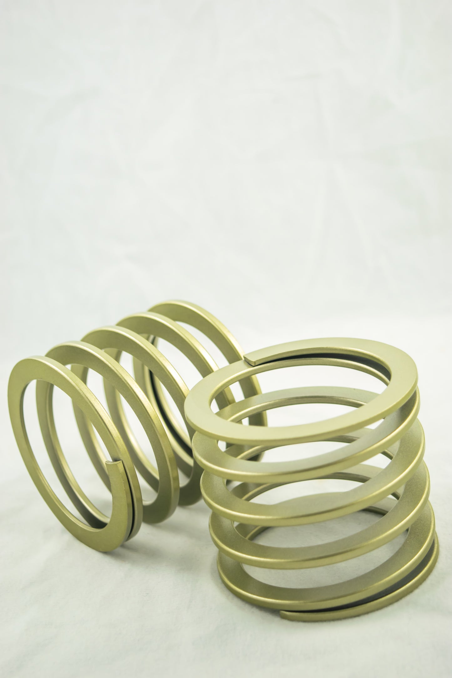 Swift Springs Bump Stop Spring - Flat Wire - 135 mm Length - 60 mm ID - 0.8 kgf/mm Spring Rate - Steel - Gold Powder