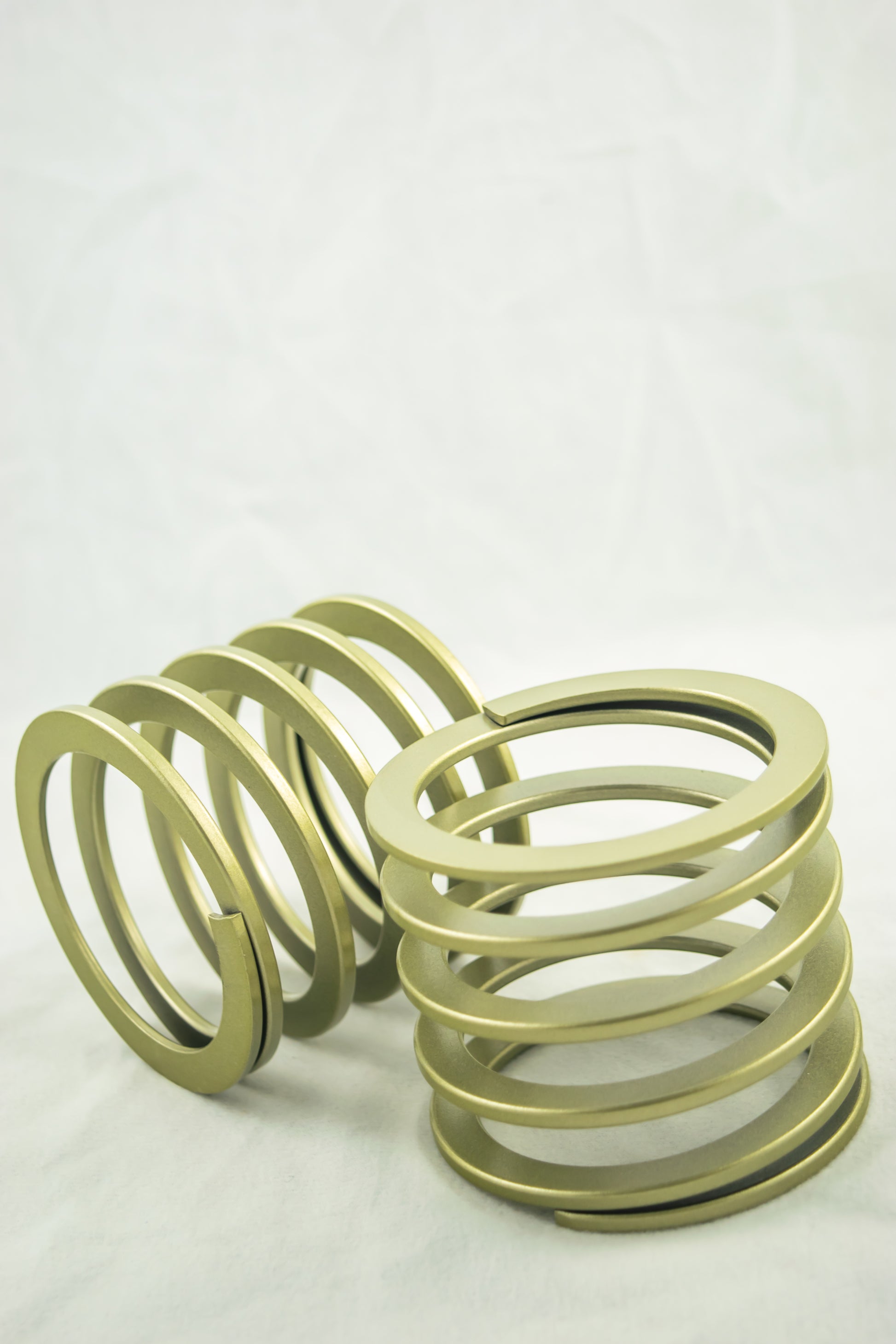 Swift Springs Bump Stop Spring - Flat Wire - 135 mm Length - 60 mm ID - 0.8 kgf/mm Spring Rate - Steel - Gold Powder