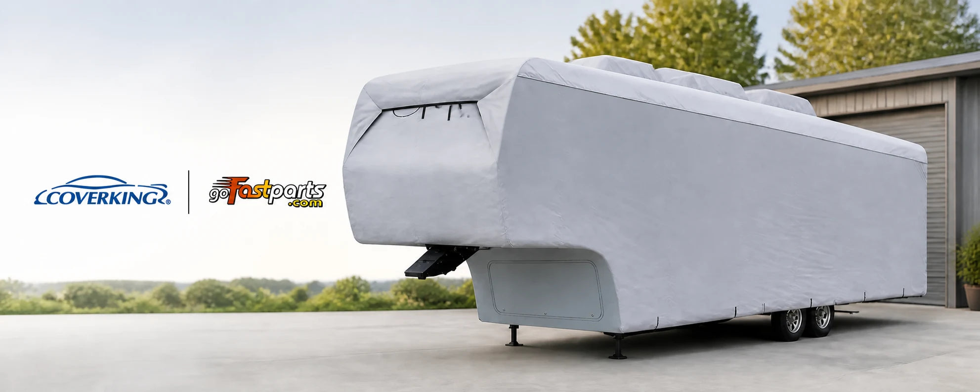 Coverking and GoFastParts logos beside a fifth-wheel RV protected by a fitted light grey storage cover.